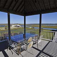 Gazebo has an outdoor dining area.  The gas bbq is here, too. 