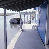 The old clam house on this site, circa 1971.  Chik Reed's boat.  It's gone, the engine block is visible at very low tide..